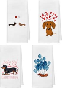 4 white kitchen towels with different cartoons of dachshunds