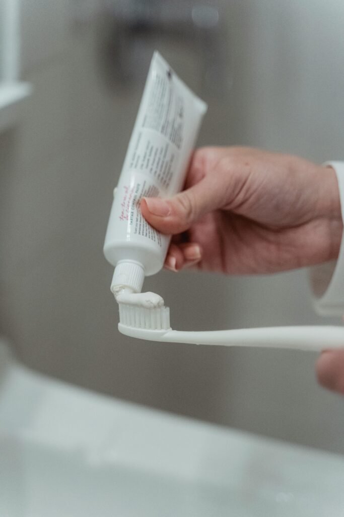 Foods That Are Toxic To DOGS! - BE INFORMED 16 Detailed close-up of toothpaste being applied to a toothbrush, emphasizing hygiene.