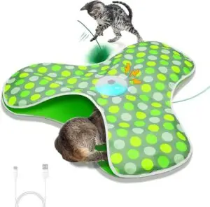Rechargeable electronic cat toy mat with spinning feather teaser under a green polka dot cover – fun and stimulating hide-and-seek toy for cats