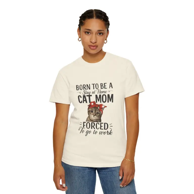 Woman wearing a brown T-shirt that says “Born to Be a Stay at Home Cat Mom, Forced to Go to Work,” featuring a cute tabby kitten with a red polka-dot bandana—perfect funny gift for cat lovers and pet moms.