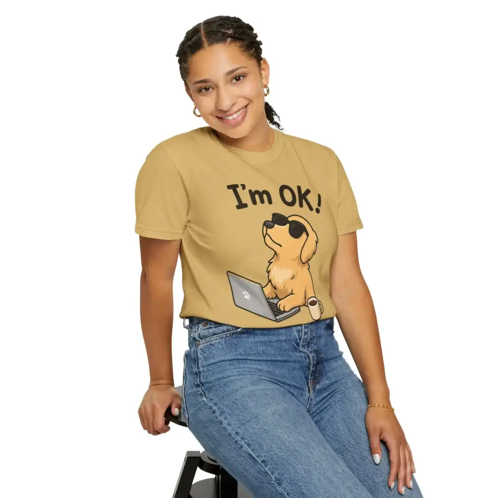 I'm Ok T-shirt in mustard on a girl shitting on a chair. Dog wearing sunglasses at a computer with a coffee on the side