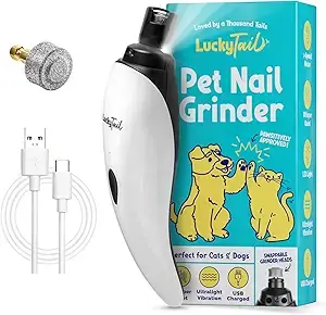 Pet/Cat/Dog Nail Grinders Vs. Clippers 12 White and black LuckyTail pet nail grinder with USB charging cable and textured grinding head, shown next to branded blue packaging featuring illustrations of dogs and key product benefits.