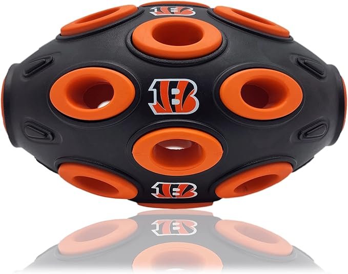 Cincinnati Bengals football-shaped dog treat dispensing toy with multiple holes, designed for interactive play and mental stimulation for pets.