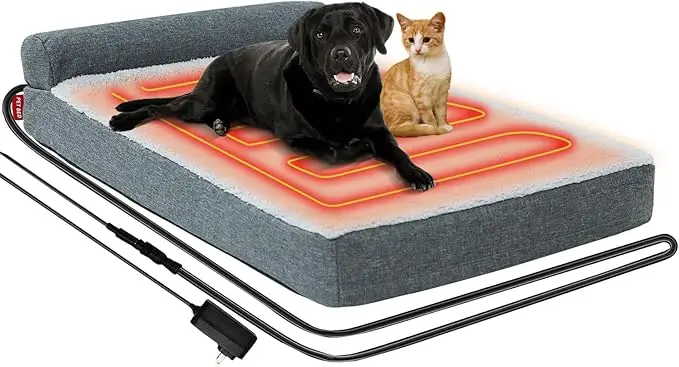 Black Labrador dog and orange cat lying together on a large heated pet bed with visible warming coils — a cozy multi-pet option in fall essentials for dogs 2025.